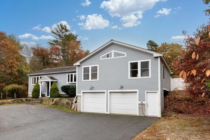 242 Hedges Pond Road Plymouth, MA 02360 - Photo 27 of 38 a front view of house with yard and trees in the background