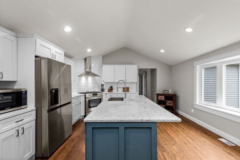 242 Hedges Pond Road Plymouth, MA 02360 - Photo 5 of 38 a kitchen with kitchen island a sink stove and refrigerator