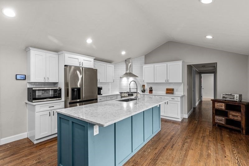 242 Hedges Pond Road Plymouth, MA 02360 - Photo 7 of 38 a kitchen with refrigerator and cabinets