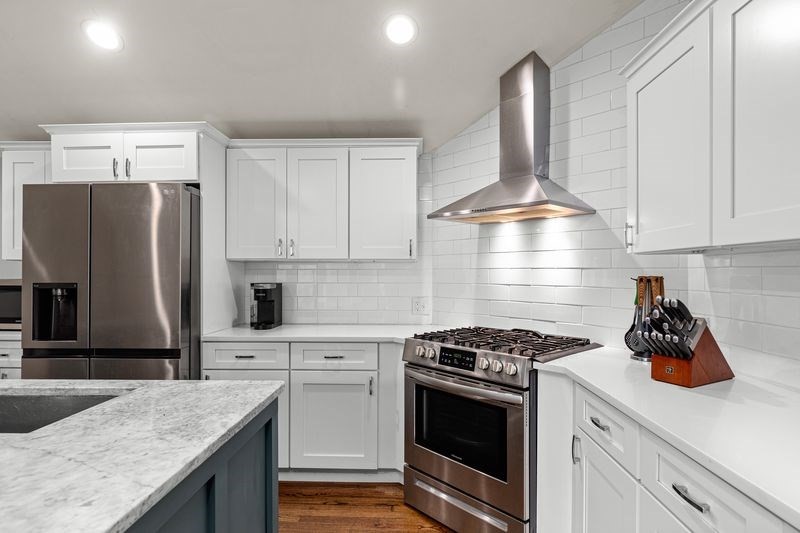 242 Hedges Pond Road Plymouth, MA 02360 - Photo 8 of 38 a kitchen with stainless steel appliances granite countertop a sink stove and refrigerator