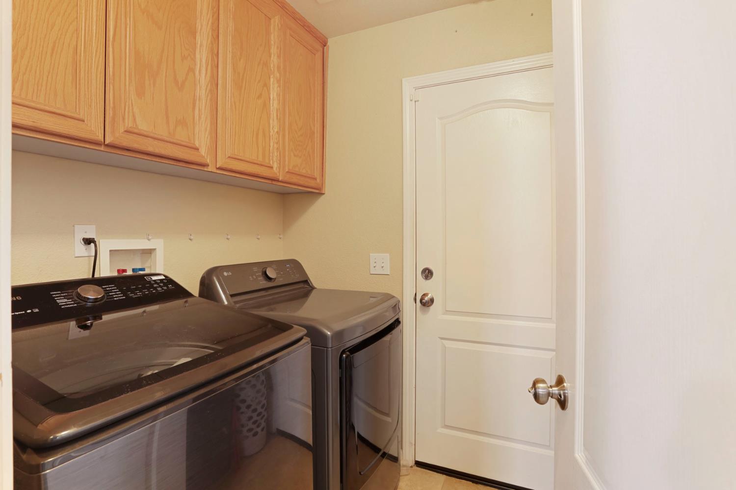 277 Fragrance Street Manteca, CA 95337 - Photo 22 of 27 a utility room with dryer and washer