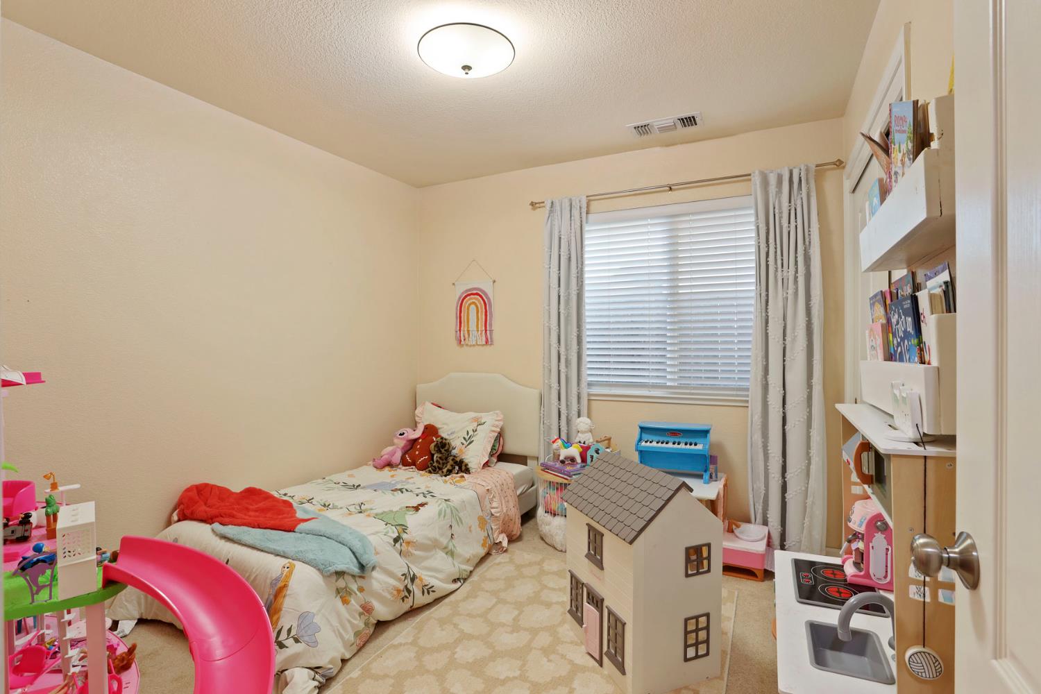 277 Fragrance Street Manteca, CA 95337 - Photo 24 of 27 a bed room with a bed and a chair