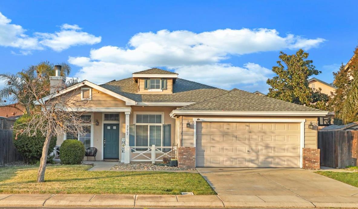277 Fragrance Street Manteca, CA 95337 - Photo 26 of 27 a front view of a house with garden