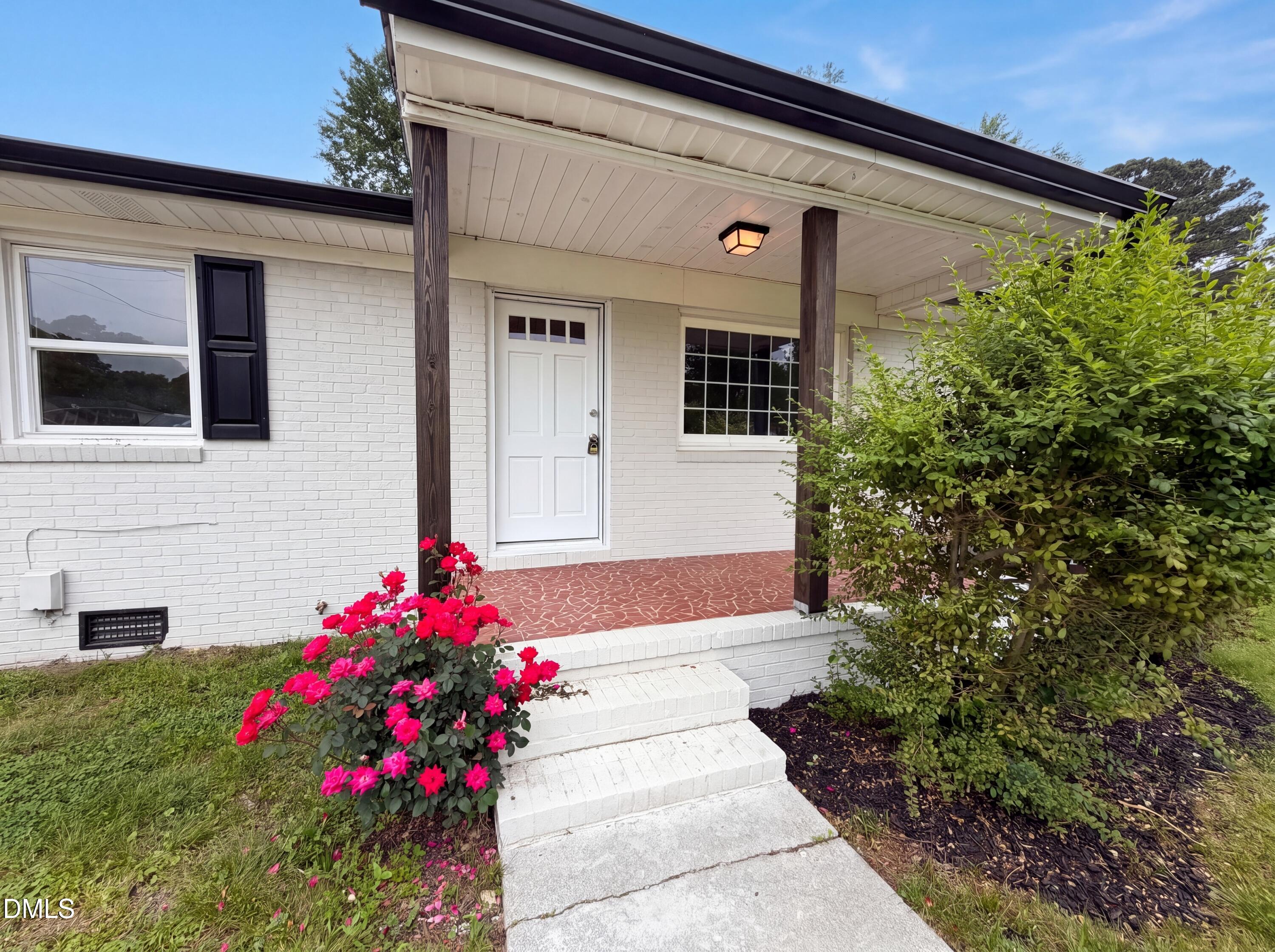 303 Stancil Street Smithfield, NC 27577 - Photo 15 of 16 a view of a house with potted plants