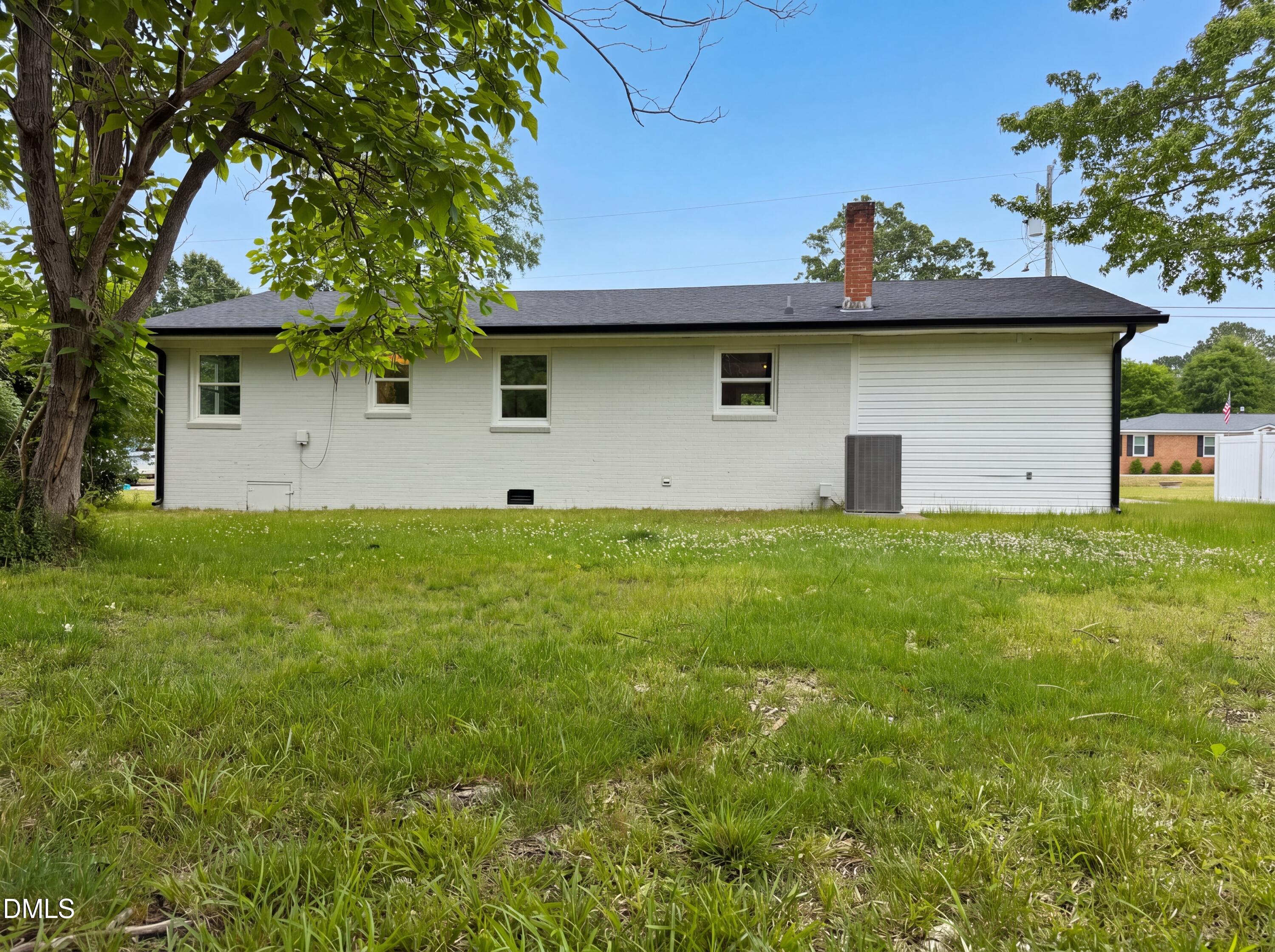 303 Stancil Street Smithfield, NC 27577 - Photo 5 of 16 a house view with a garden space