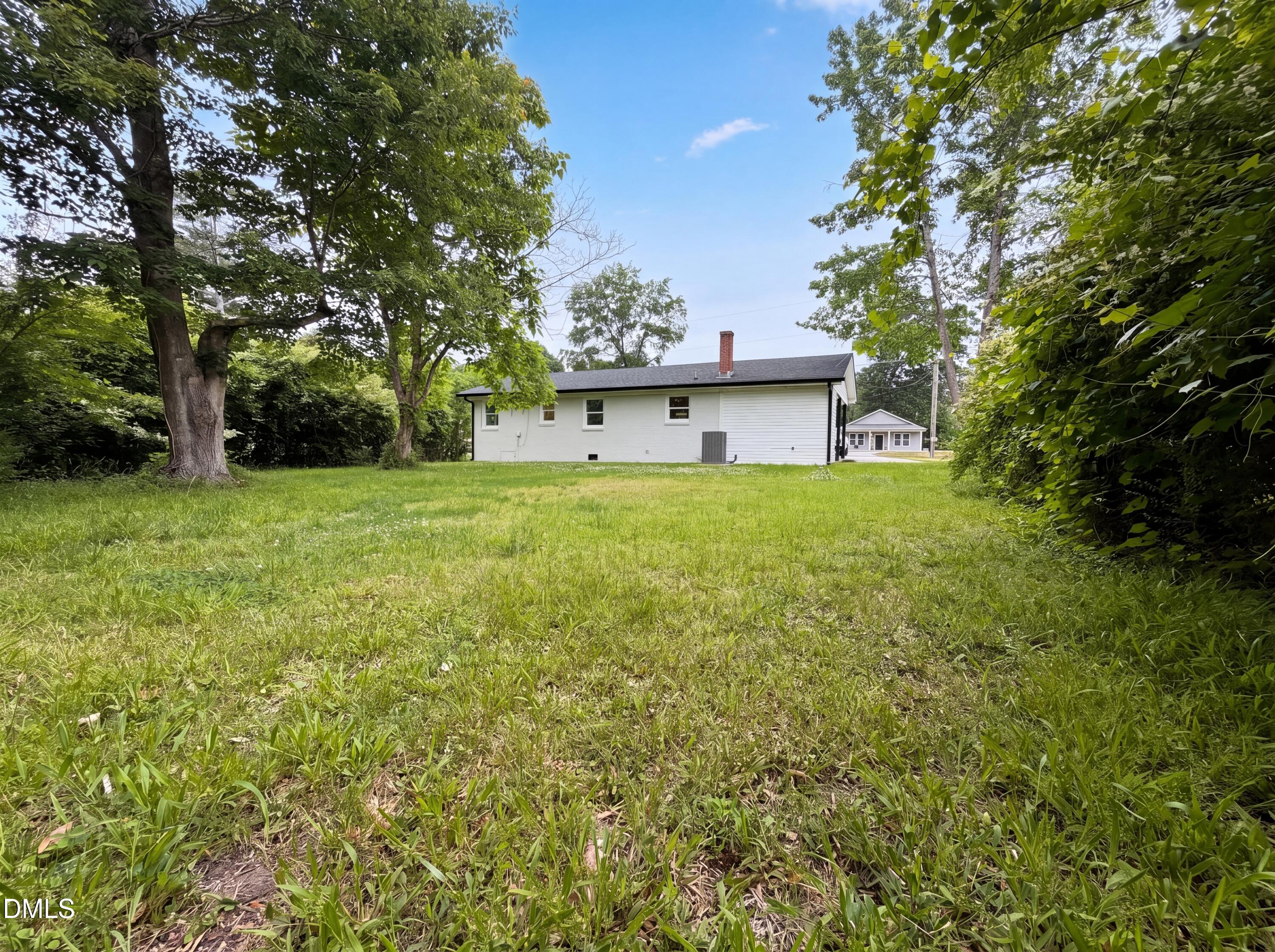 303 Stancil Street Smithfield, NC 27577 - Photo 7 of 16 a house view with a garden space