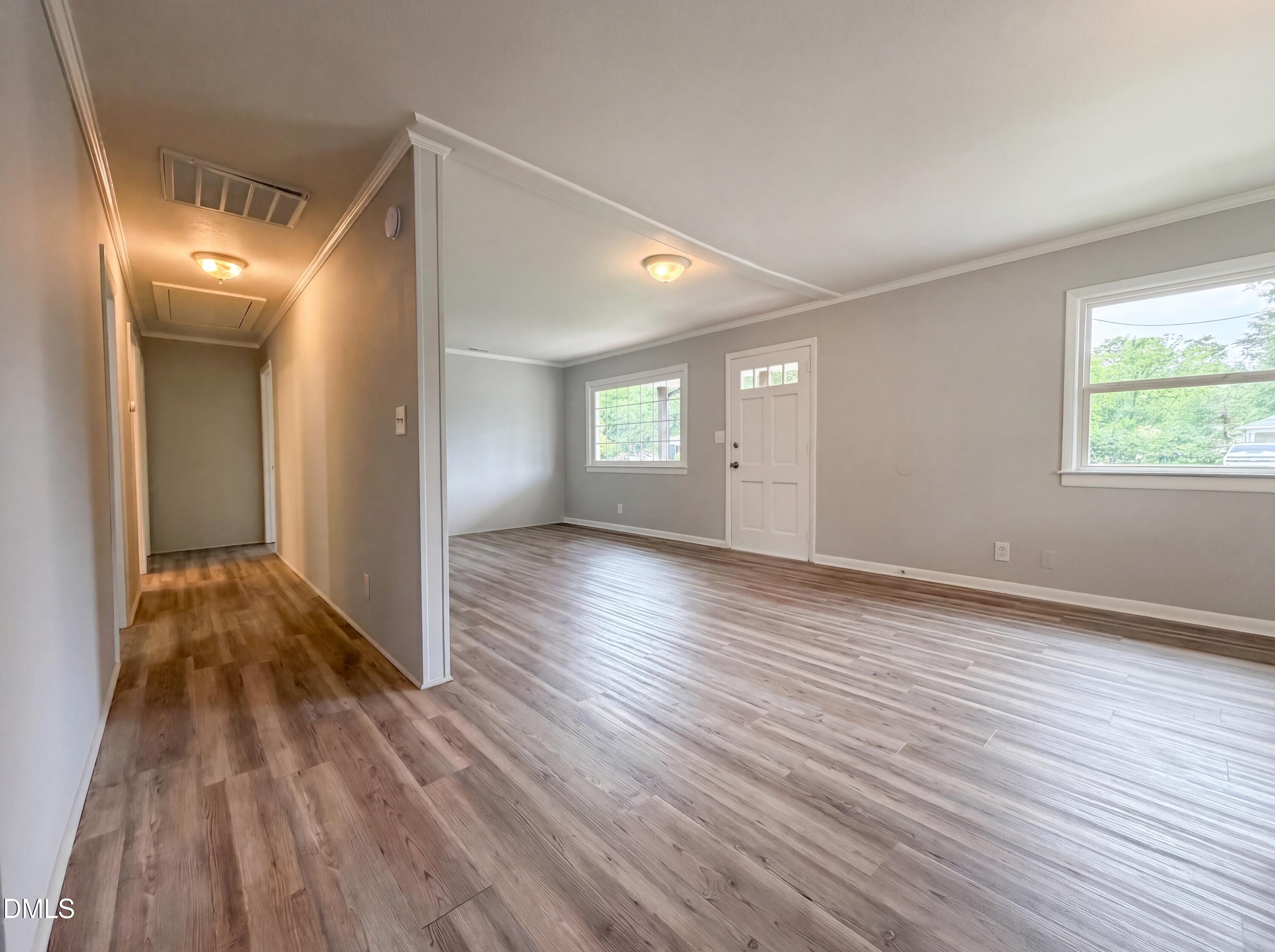 303 Stancil Street Smithfield, NC 27577 - Photo 9 of 16 a view of a room with wooden floor and window