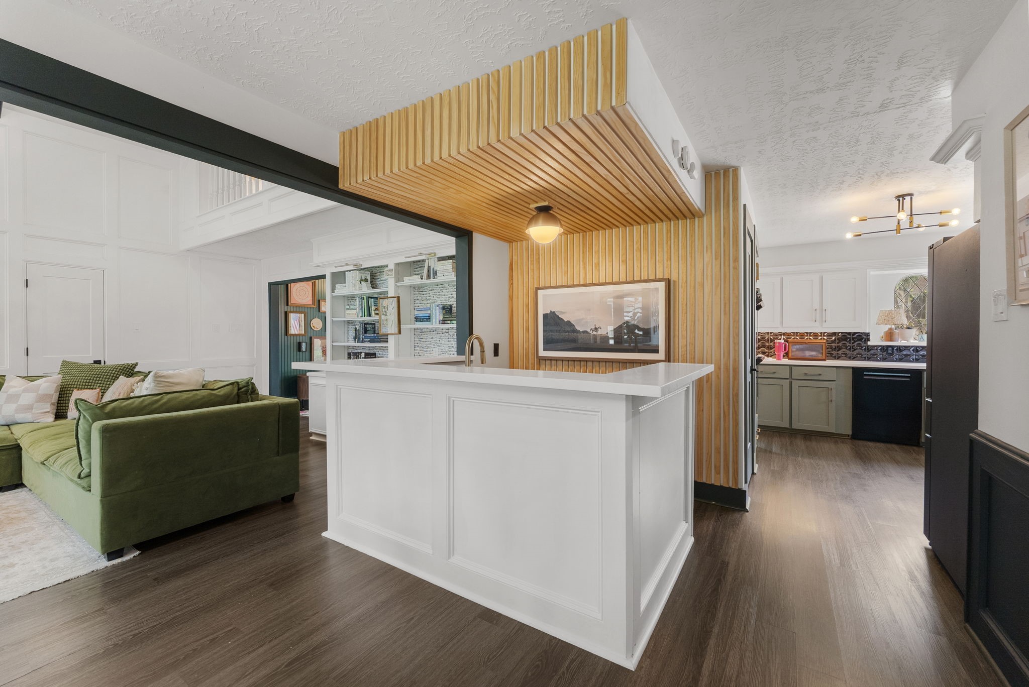 3414 Blue Candle Drive Spring, TX 77388 - Photo 8 of 29 Beautifully updated wet bar with custom wood detailing, quartz countertops, and convenient access to both the kitchen and family room.