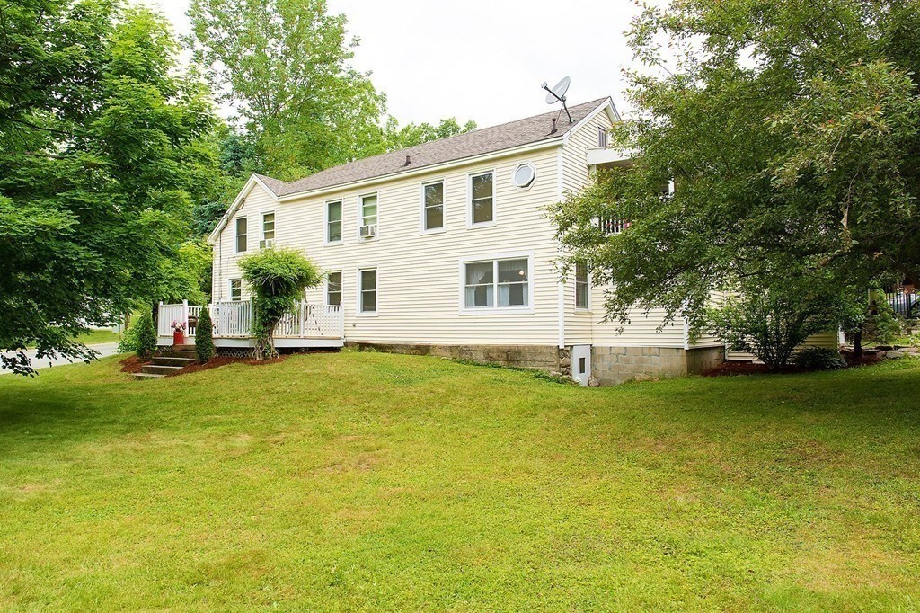 36 Brookfield Road Sturbridge, MA 01518 - Photo 4 of 9 a front view of a house with a garden