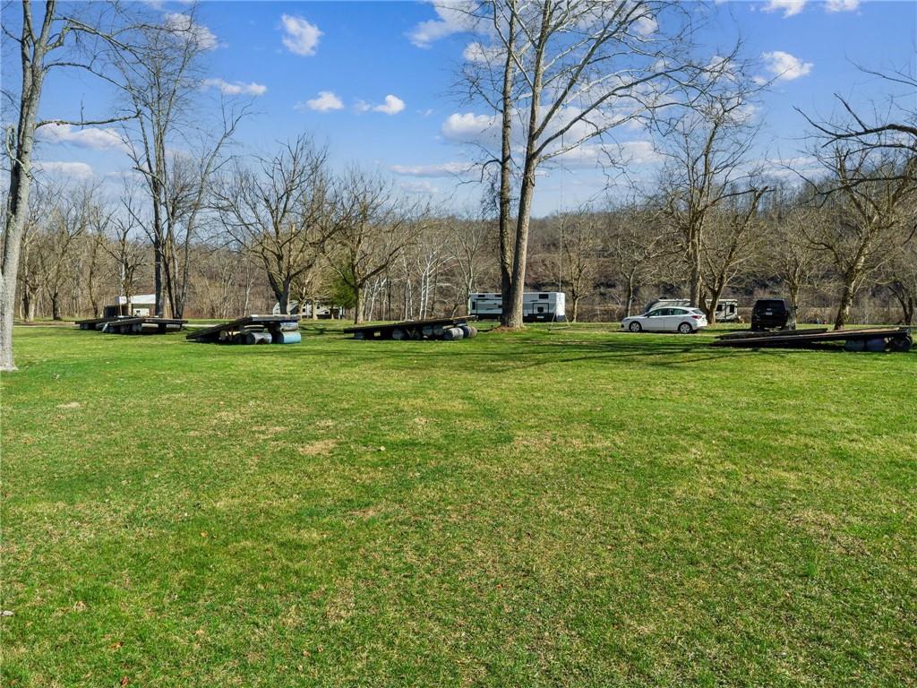100 Pond Street Denbo, PA 15417 - Photo 13 of 25 a view of a field of grass and trees