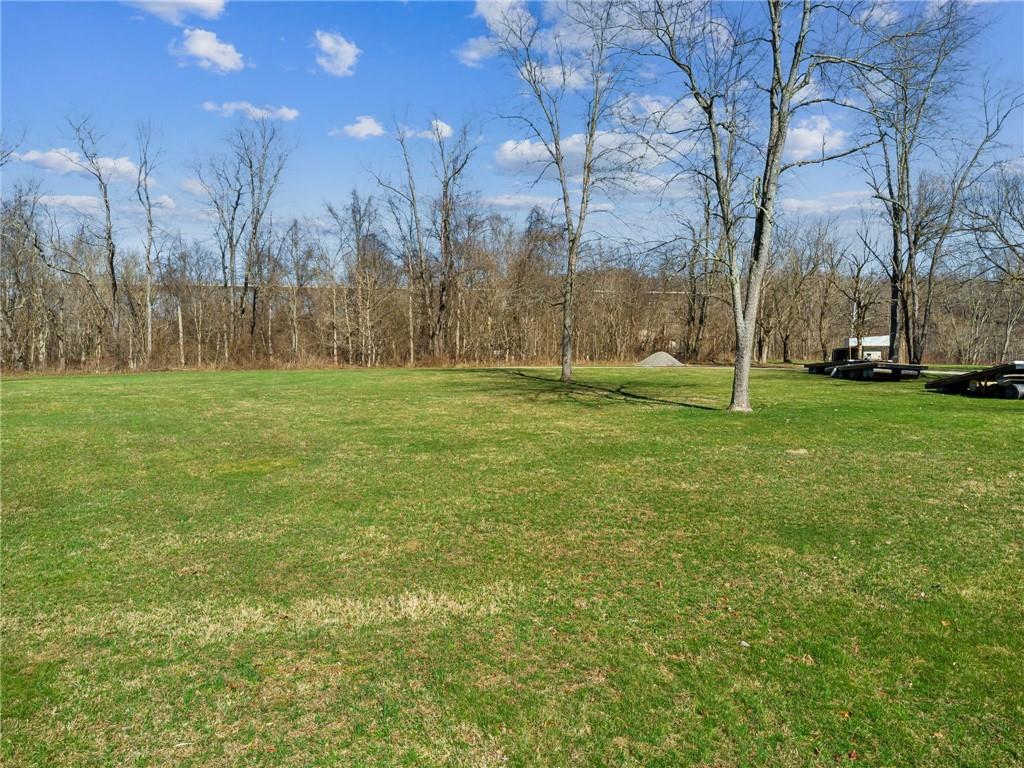 100 Pond Street Denbo, PA 15417 - Photo 16 of 25 a view of a grassy field with trees