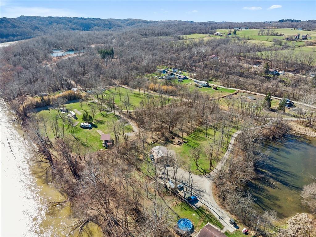 100 Pond Street Denbo, PA 15417 - Photo 22 of 25 a view of a lake with a mountain in the background
