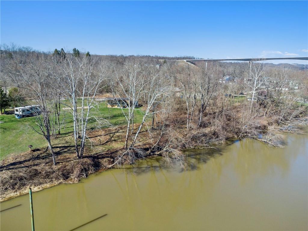 100 Pond Street Denbo, PA 15417 - Photo 6 of 25 a view of a lake with a yard