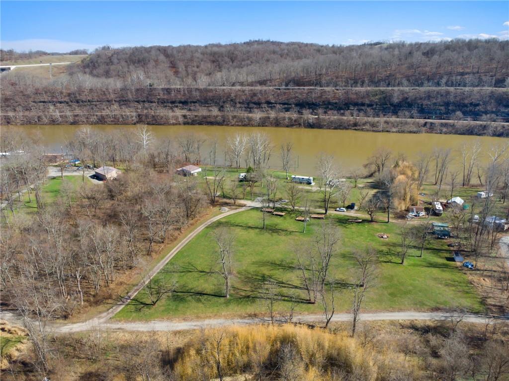 100 Pond Street Denbo, PA 15417 - Photo 8 of 25 a view of a lake with a yard and mountain view
