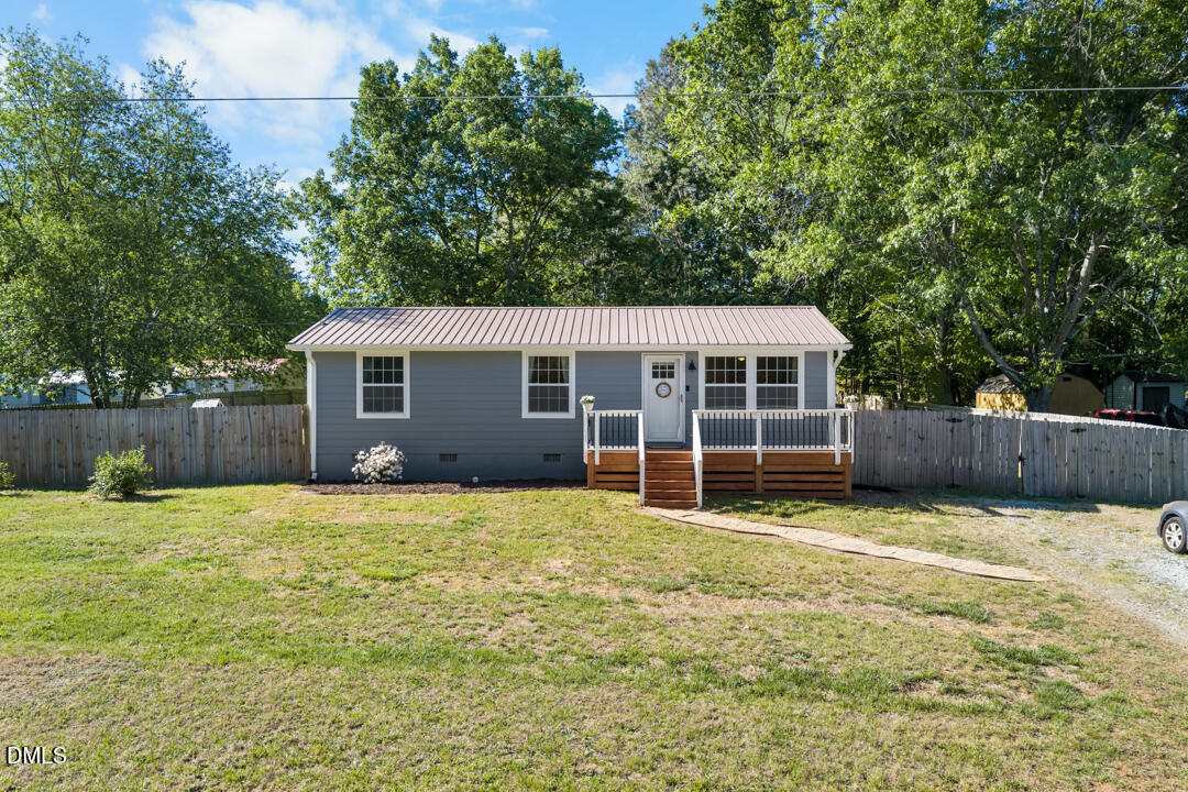 454 Cedar Creek Road Timberlake, NC 27583 - Photo 6 of 39 a view of a house with a yard and deck