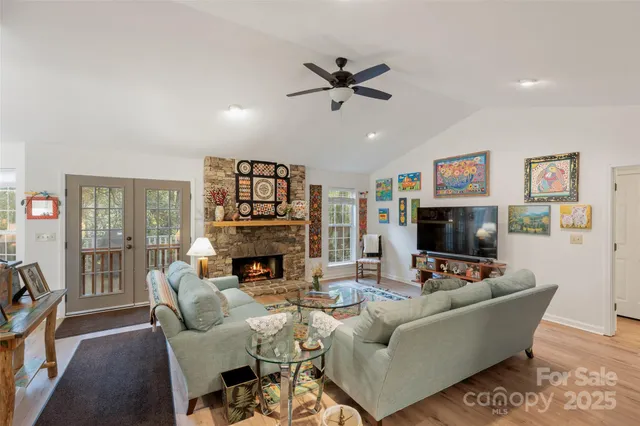a room with stainless steel appliances kitchen island granite countertop furniture and a kitchen view