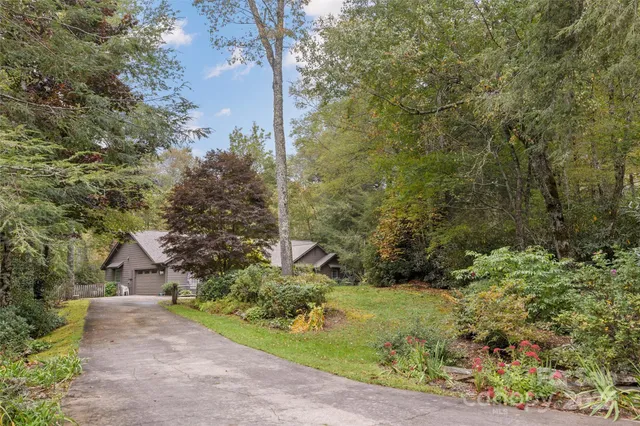 a kitchen with a sink cabinets and wooden floor