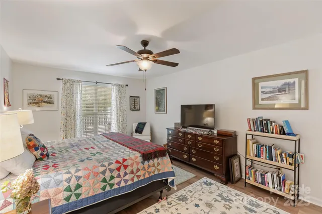 a bathroom with a double vanity sink a mirror and a bathtub