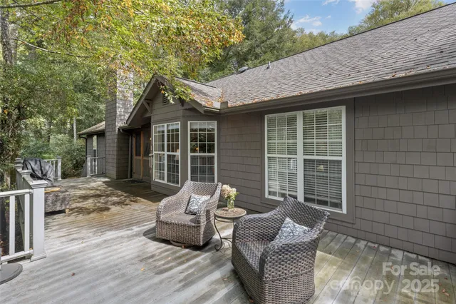 a room with a dresser and a chandelier