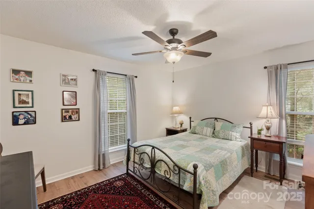 a bathroom with a sink a toilet and shower curtain