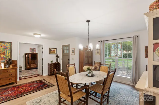 a view of a lush green hillside and a houses
