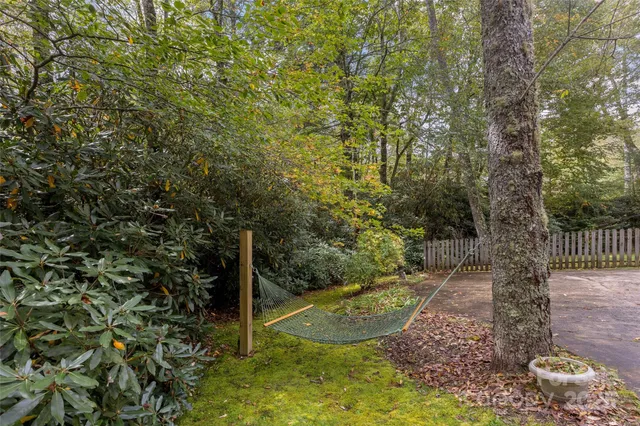 a view of a swimming pool with a yard