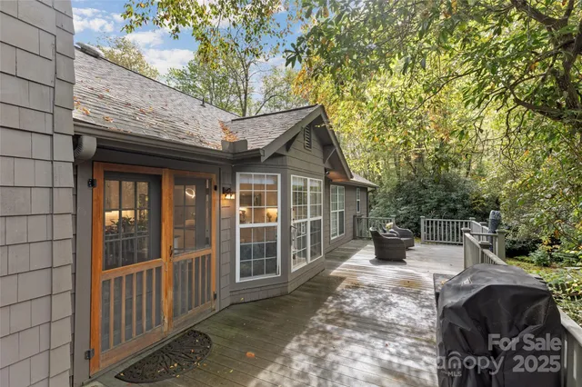 a living room with furniture fireplace and rug