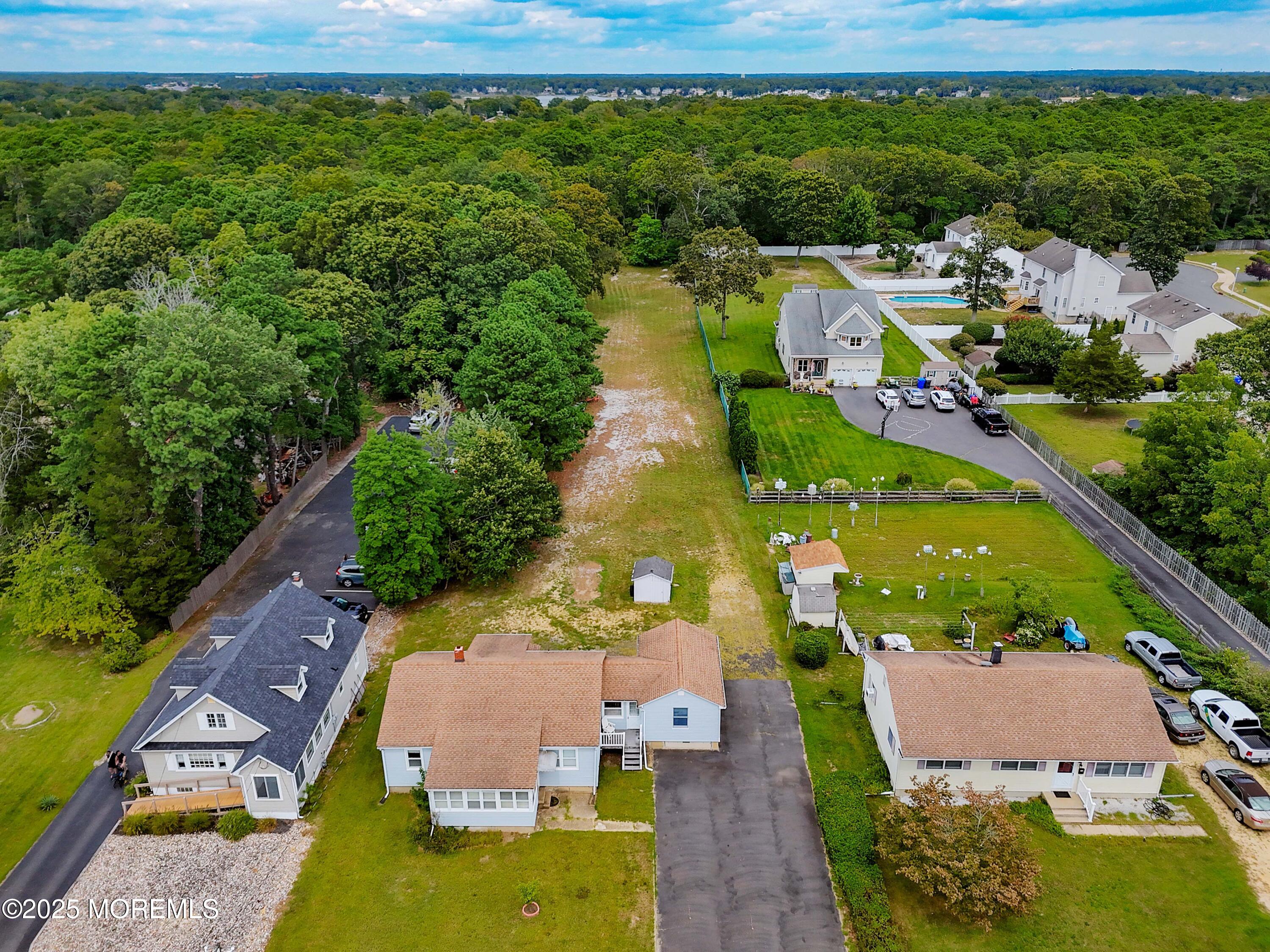 230 Drum Point Road Brick, NJ 08723 - Photo 23 of 31 an aerial view of house with yard swimming pool and outdoor seating
