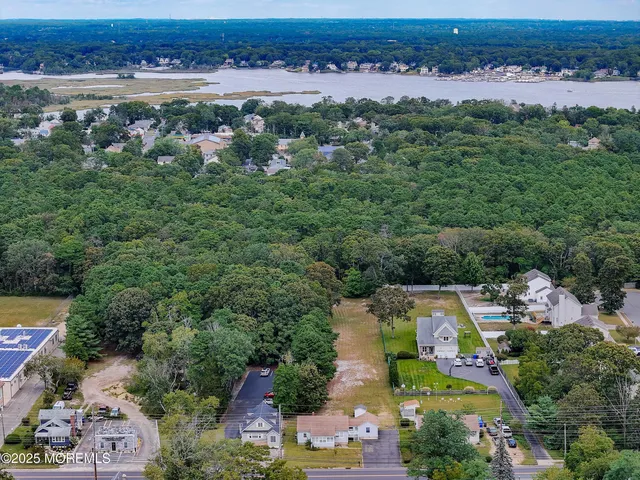 an aerial view of a city with lots of residential buildings and mountain view