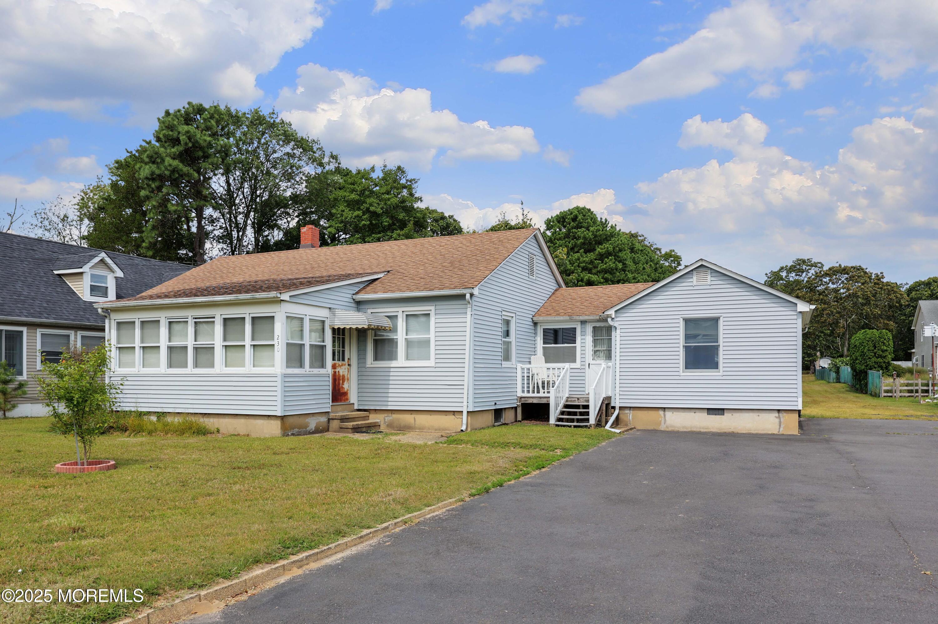 230 Drum Point Road Brick, NJ 08723 - Photo 5 of 31 a front view of a house with a garden