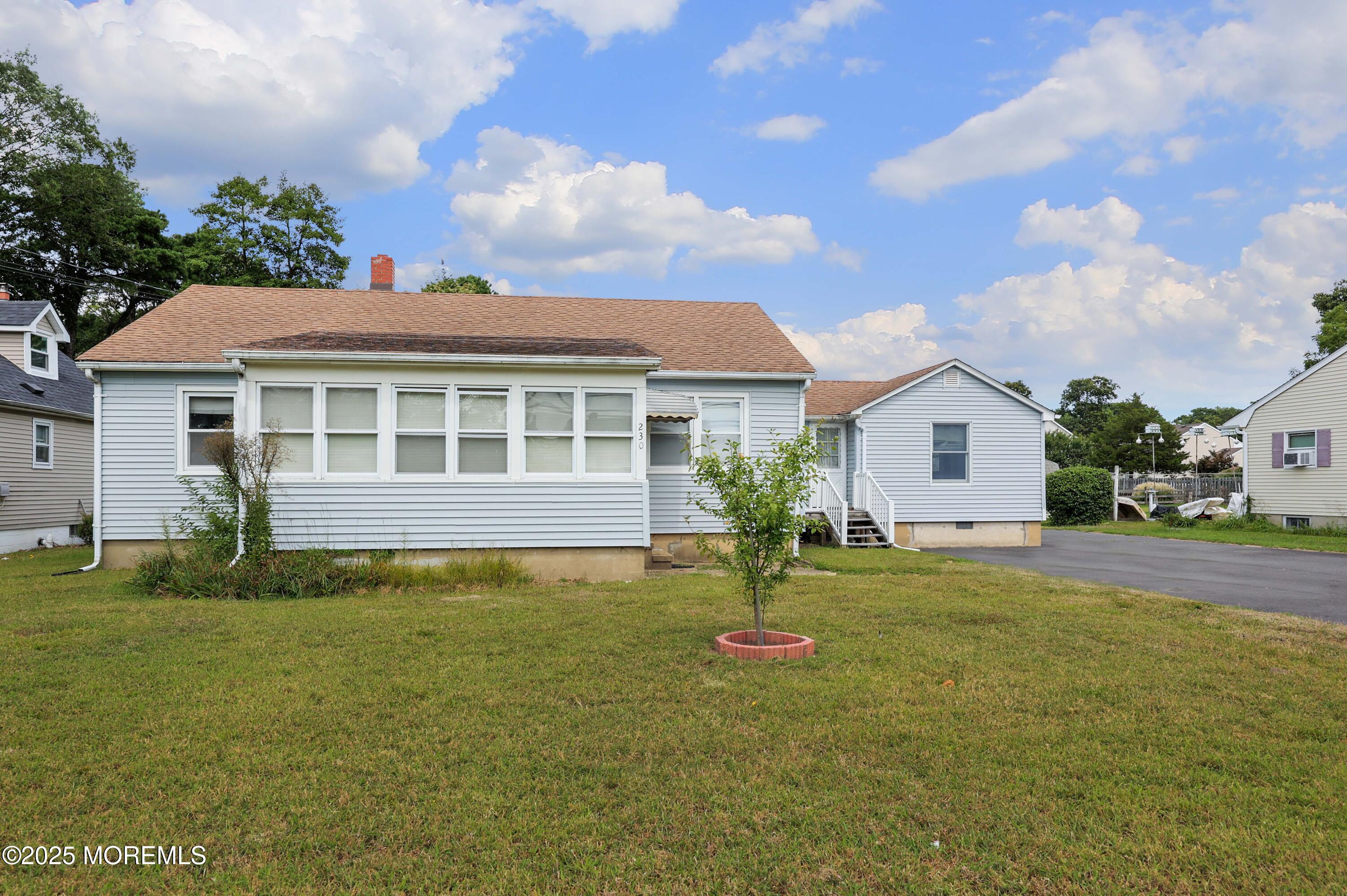 230 Drum Point Road Brick, NJ 08723 - Photo 6 of 31 a front view of a house with a yard