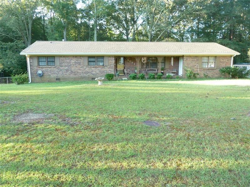 5171 Cherry Ridge Drive Powder Springs, GA 30127 - Photo 1 of 1 a front view of a house with a yard