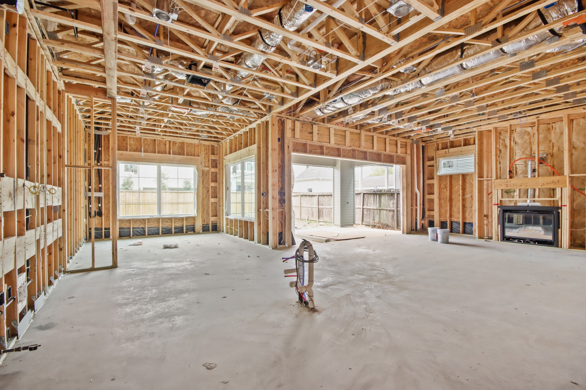 715 Merrill Street Houston, TX 77009 - Photo 11 of 50 a view of an empty room with a fireplace and large windows
