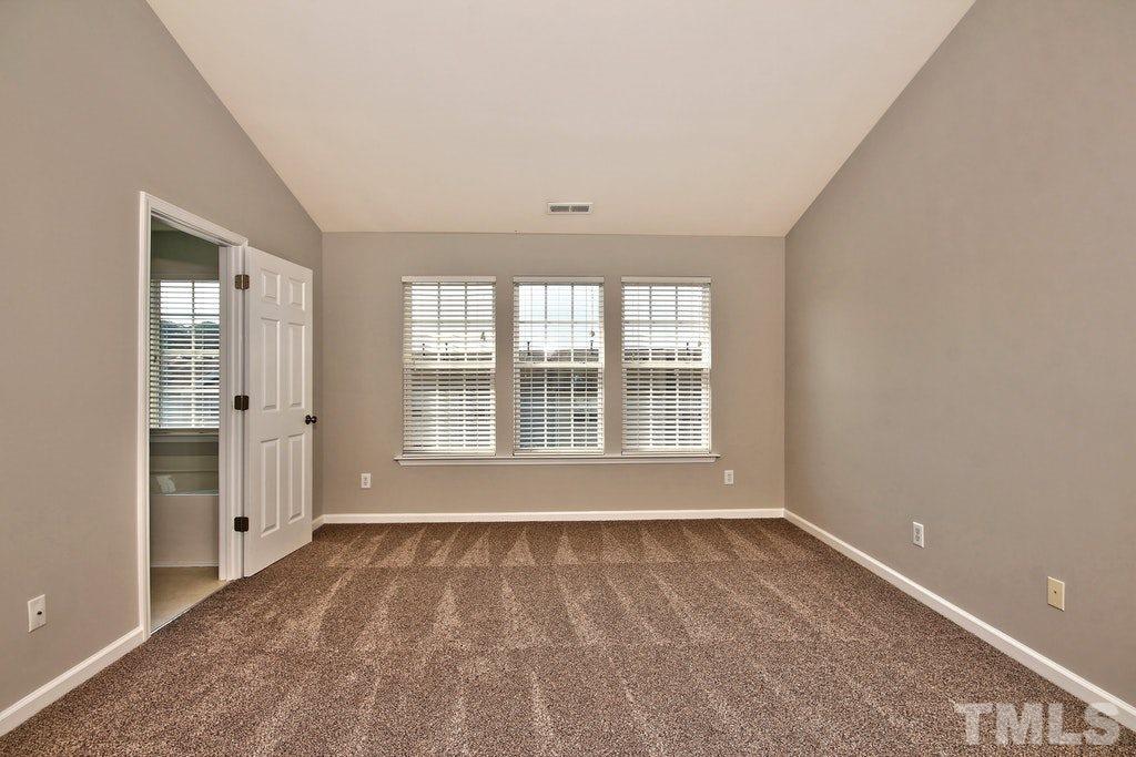 5307 Griffith Park Road Raleigh, NC 27613 - Photo 14 of 25 Large master bedroom includes new carpet and en suite.