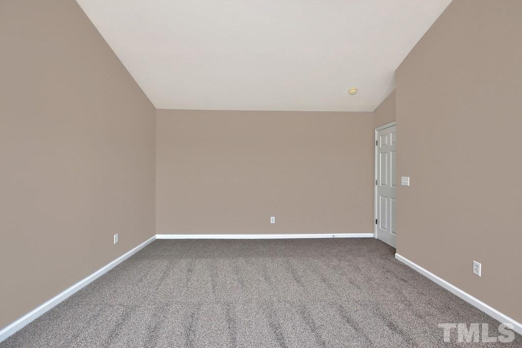 5307 Griffith Park Road Raleigh, NC 27613 - Photo 15 of 25 Another view of the large master bedroom. (the carpet looks different due to the natural light flowing in). This bedroom also features a vaulted ceiling.