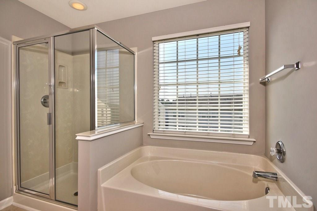 5307 Griffith Park Road Raleigh, NC 27613 - Photo 18 of 25 Soak in the garden tub after a hard day of work or play and read a good book with your glass of wine.