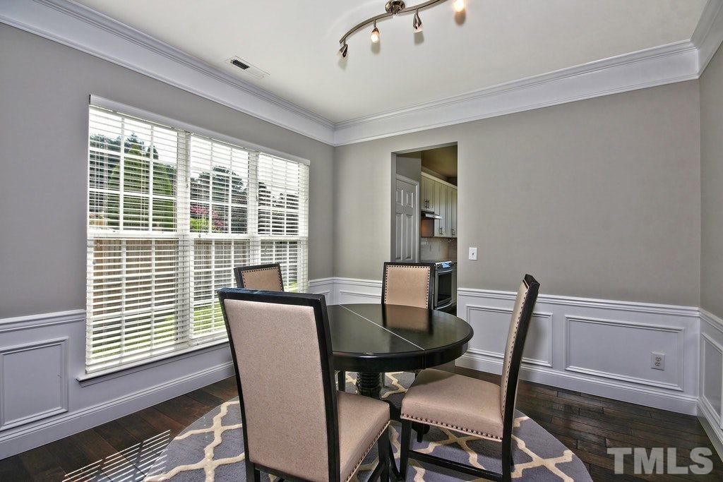 5307 Griffith Park Road Raleigh, NC 27613 - Photo 5 of 25 Wainscotting and crown molding add to the elegance of this space.