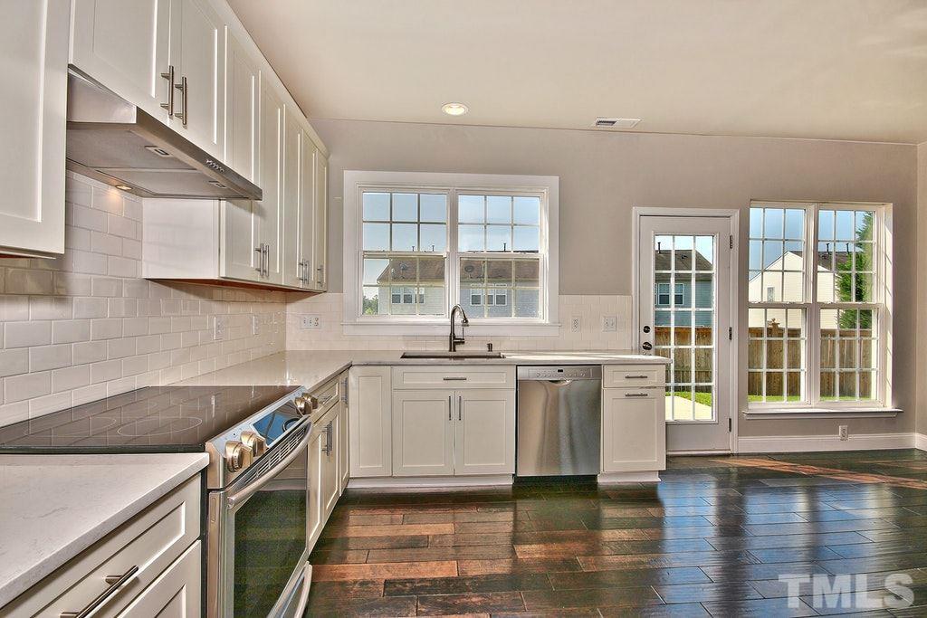 5307 Griffith Park Road Raleigh, NC 27613 - Photo 7 of 25 GORGEOUSLY updated kitchen features subway tile, coveted white cabinetry and lots of counter space for prep work before dinner.
