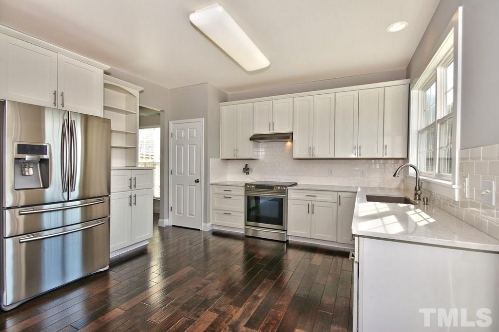 5307 Griffith Park Road Raleigh, NC 27613 - Photo 8 of 25 The kitchen also features a pantry, hooded range with warming station and stainless steel appliances.