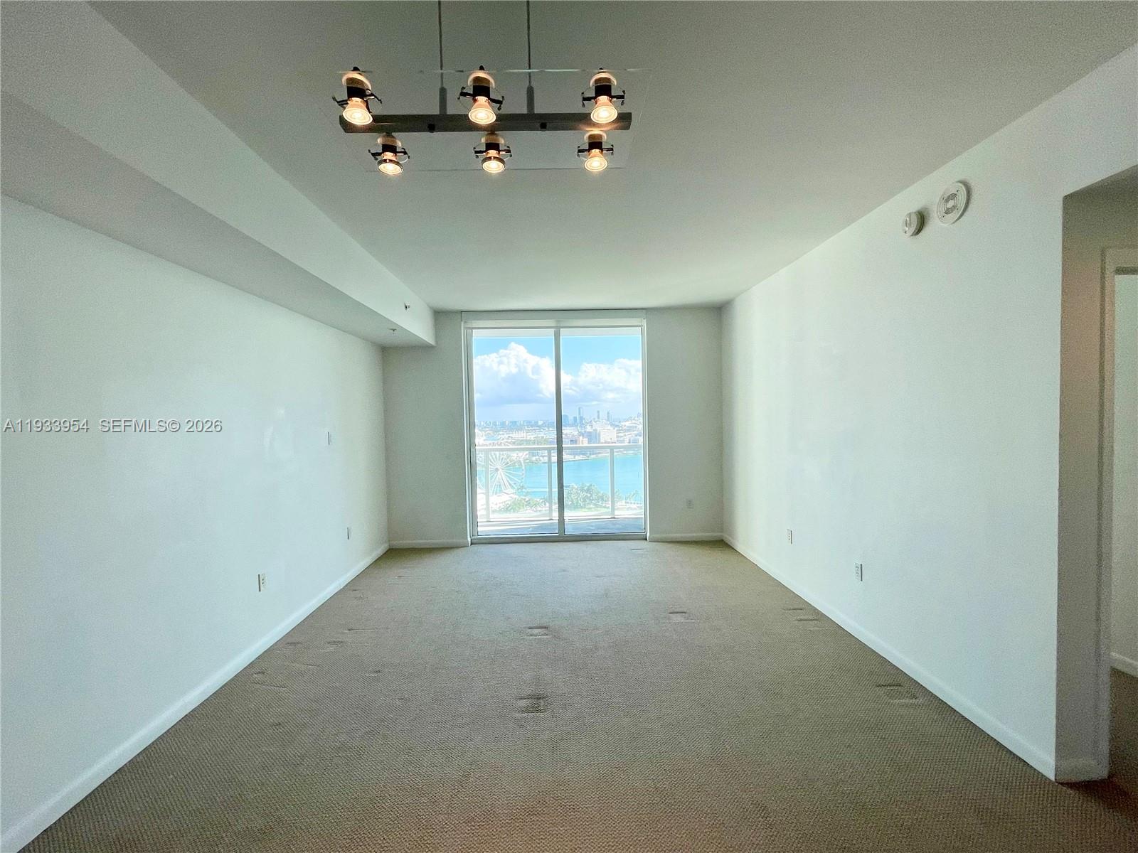 253 Northeast 2nd Street, Unit 2409 Miami, FL 33132 - Photo 17 of 61 a view of an empty room with a window