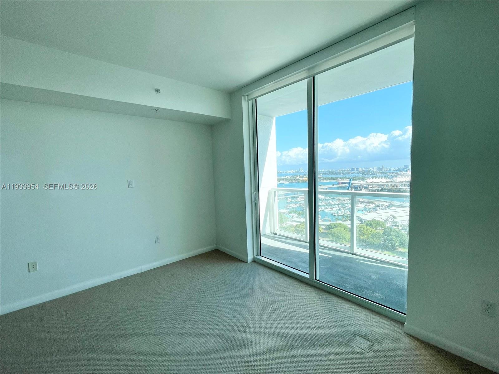 253 Northeast 2nd Street, Unit 2409 Miami, FL 33132 - Photo 20 of 61 a view of an empty room with a window