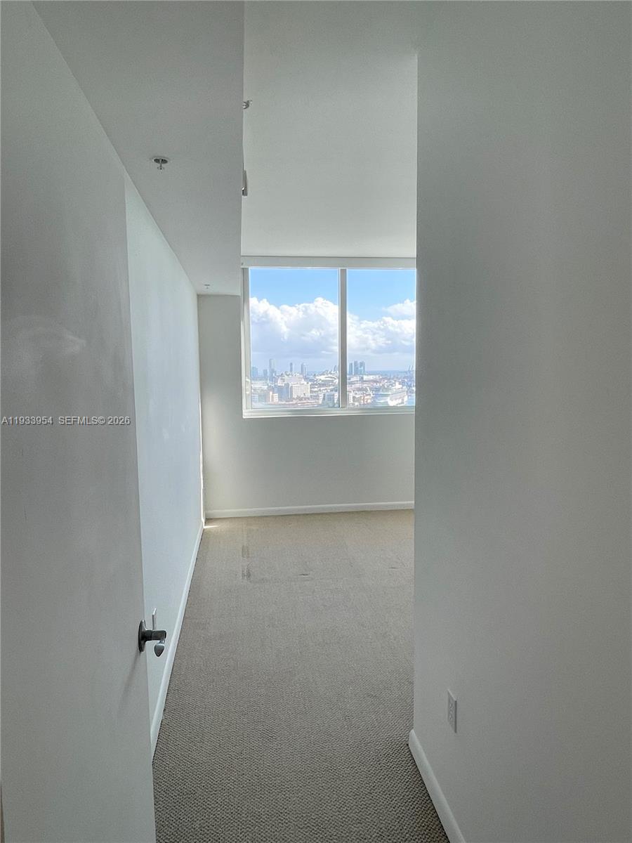 253 Northeast 2nd Street, Unit 2409 Miami, FL 33132 - Photo 24 of 61 an empty room with a window