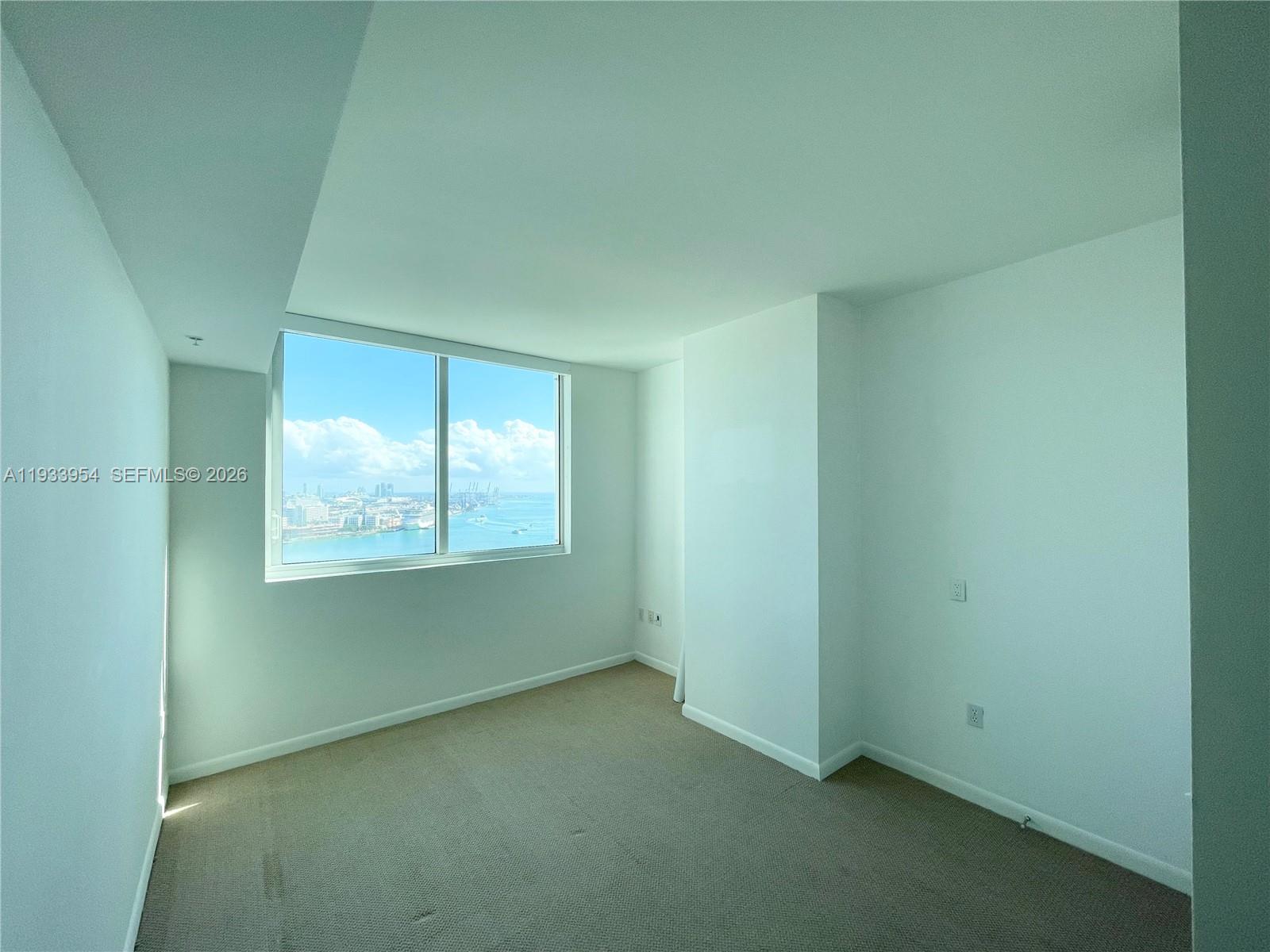 253 Northeast 2nd Street, Unit 2409 Miami, FL 33132 - Photo 25 of 61 an empty room with a window