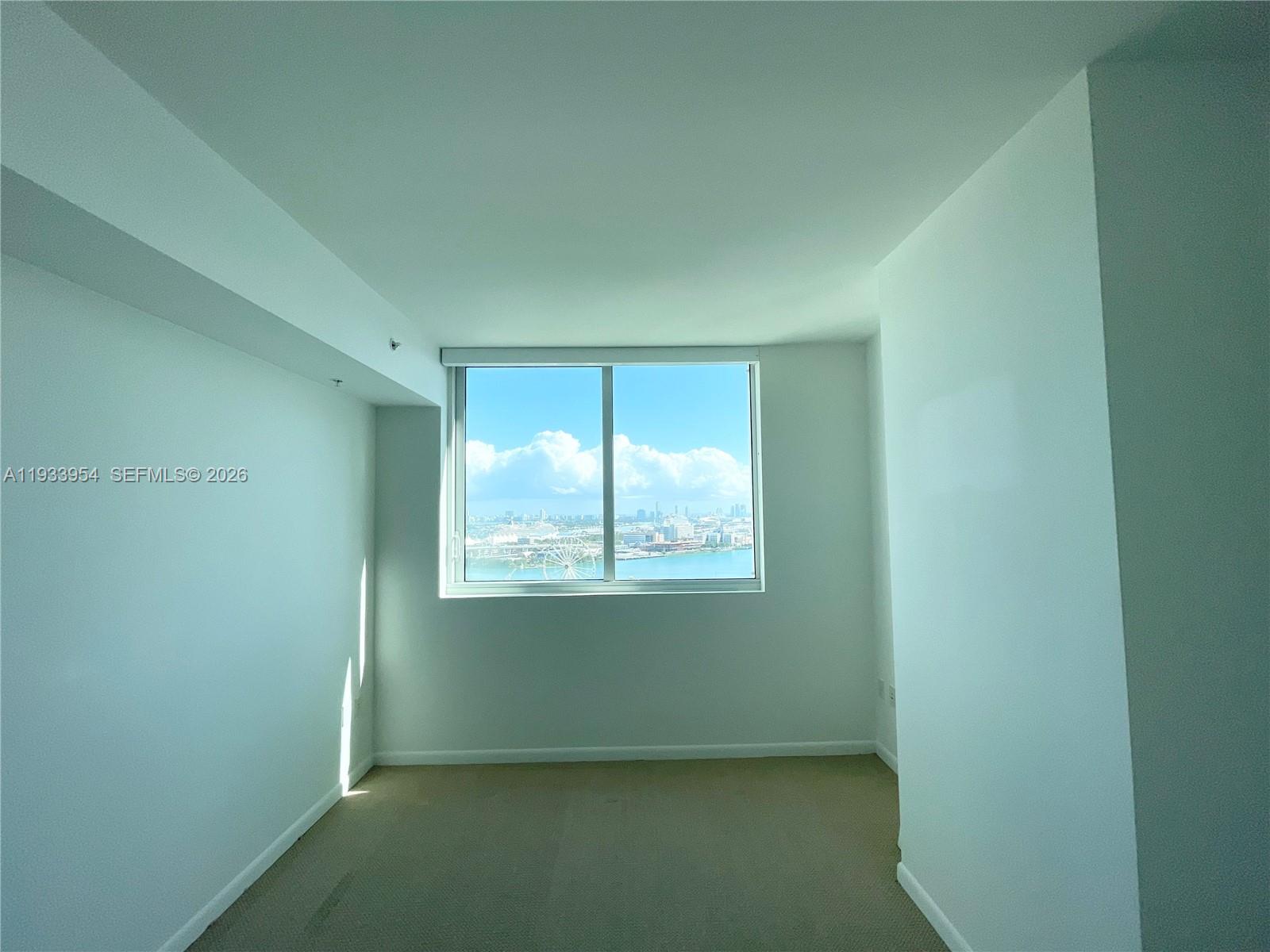 253 Northeast 2nd Street, Unit 2409 Miami, FL 33132 - Photo 26 of 61 a view of an empty room with a window