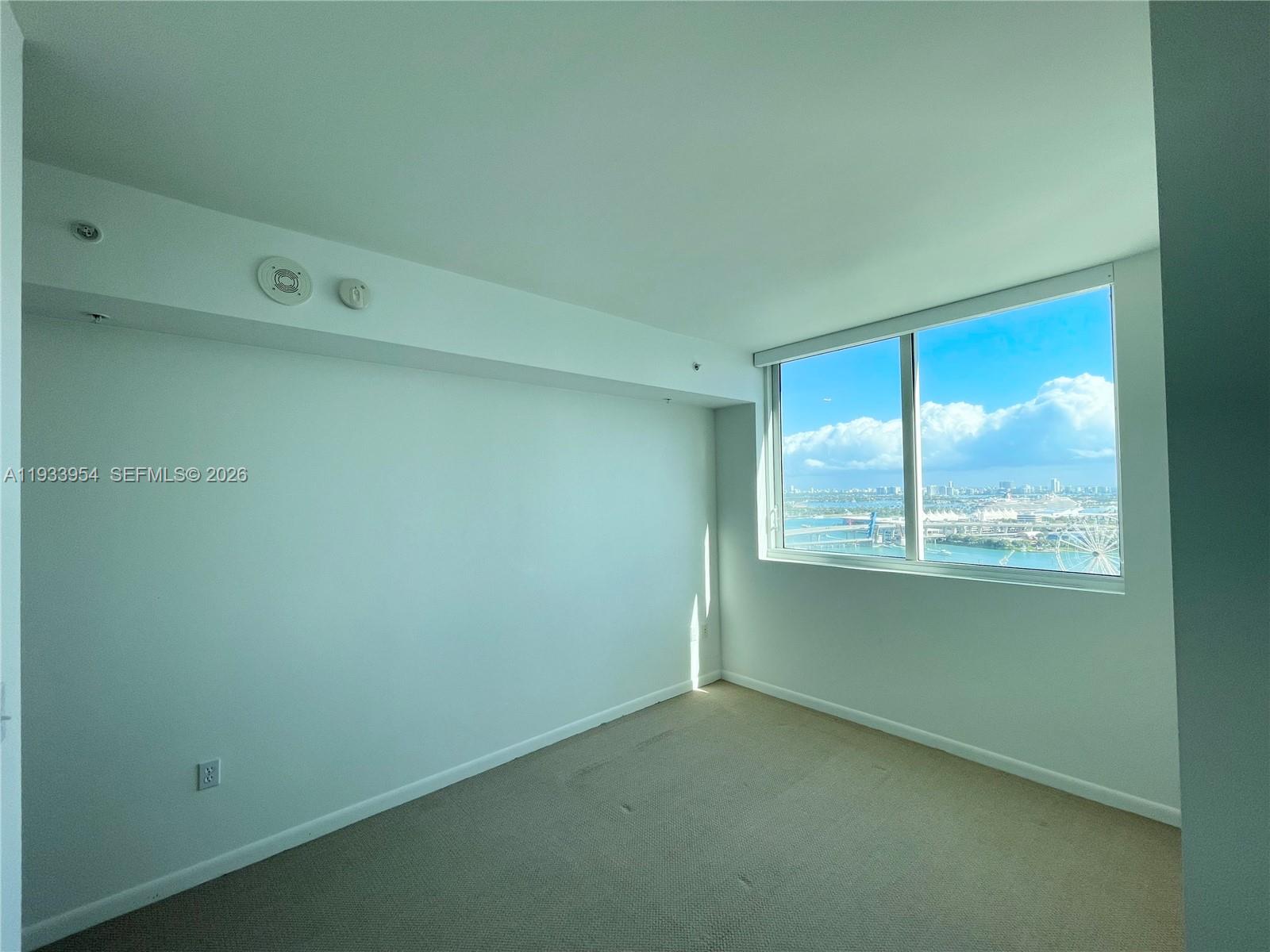 253 Northeast 2nd Street, Unit 2409 Miami, FL 33132 - Photo 27 of 61 a view of an empty room with a window
