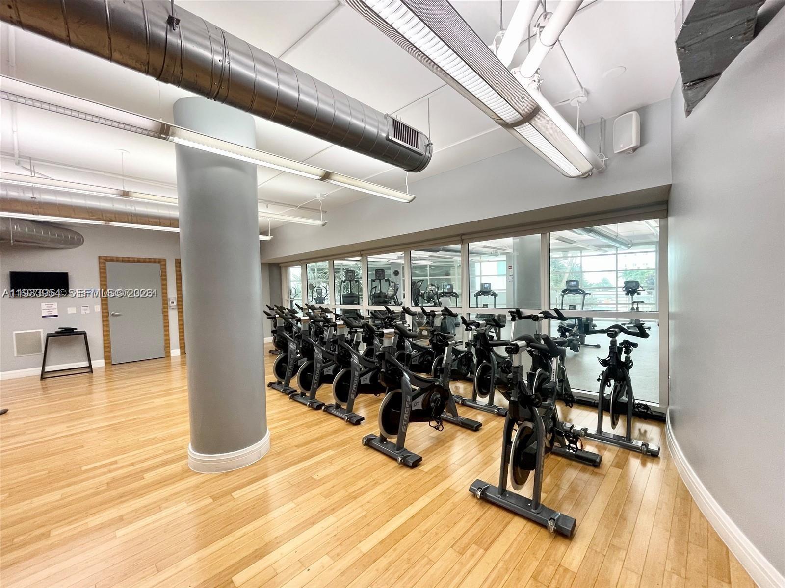 253 Northeast 2nd Street, Unit 2409 Miami, FL 33132 - Photo 54 of 61 a view of a room with gym equipment