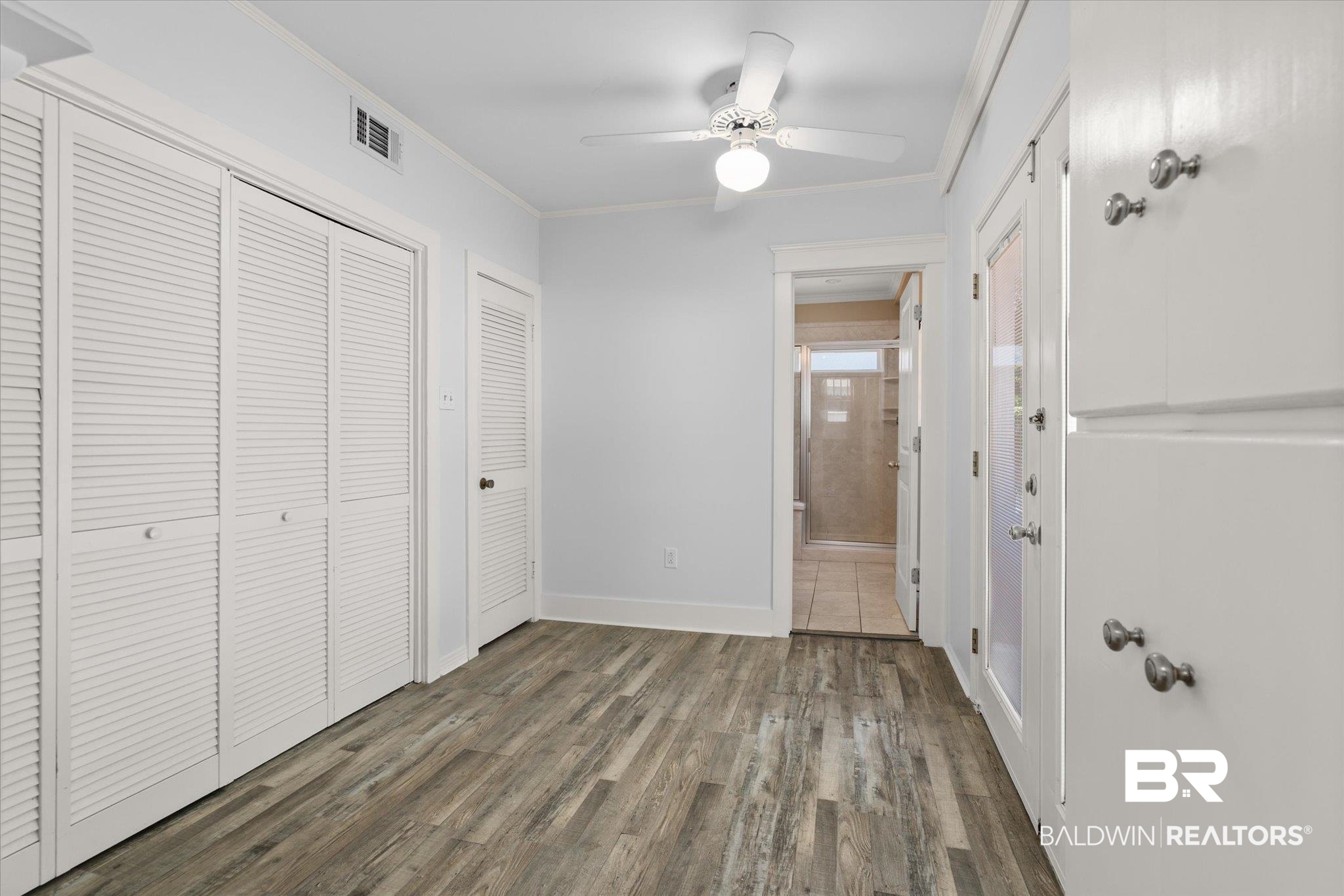24 Macy Place Mobile, AL 36604 - Photo 16 of 38 Unfurnished bedroom featuring wood finished floors, ornamental molding, baseboards, and ceiling fan