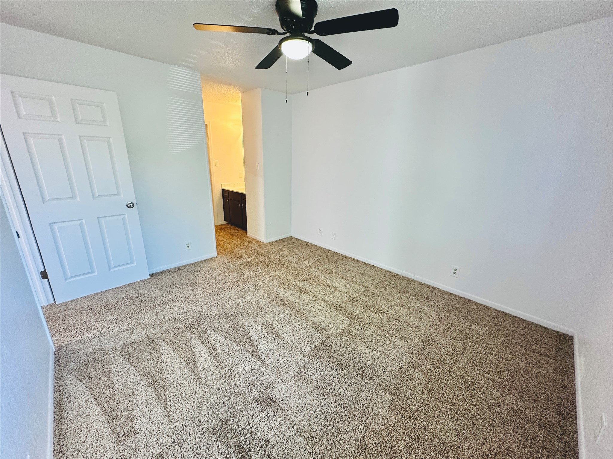 1002 Ridgemont Street Round Rock, TX 78664 - Photo 26 of 30 Unfurnished bedroom featuring light colored carpet and ceiling fan