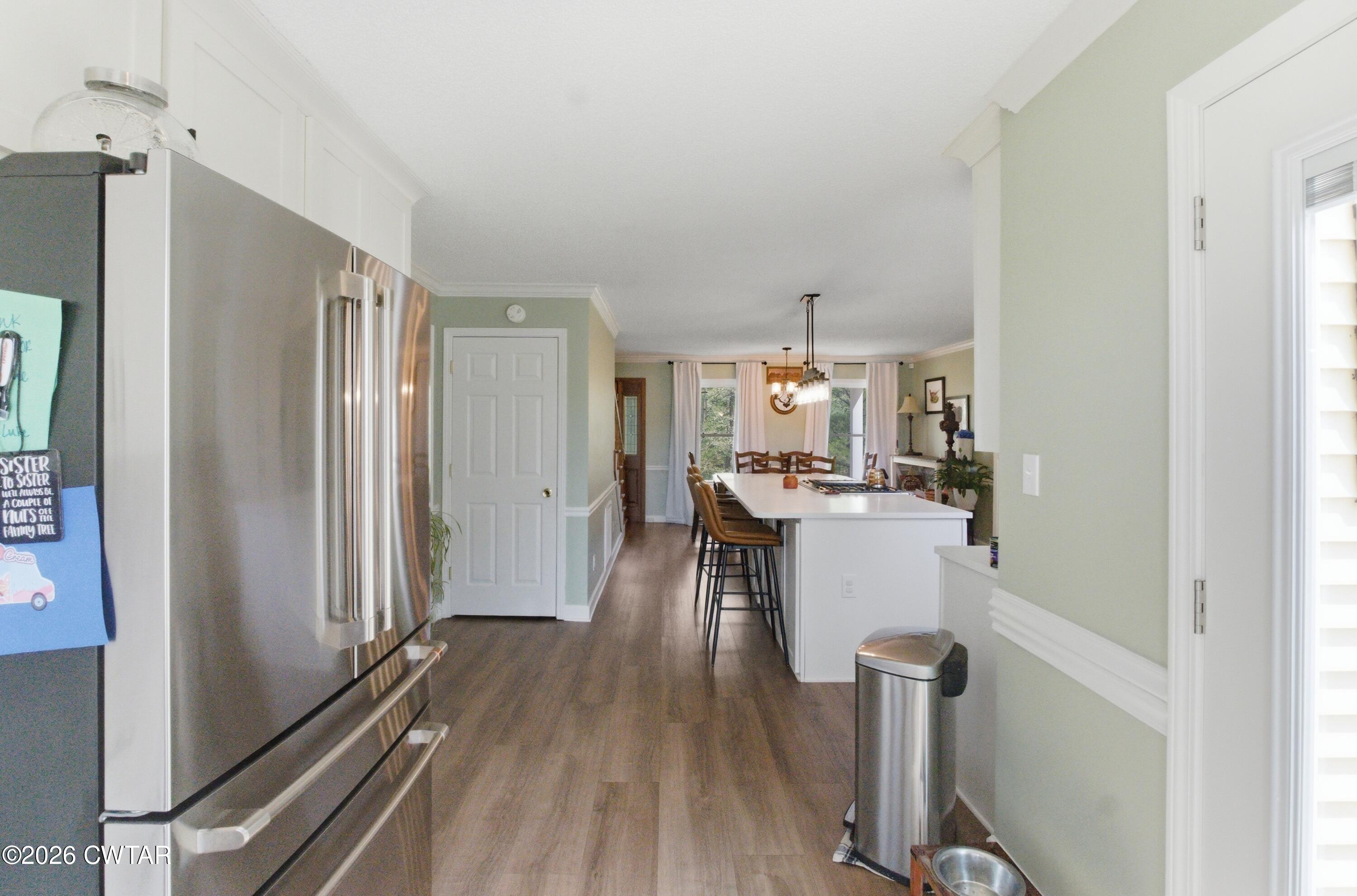 2757 Edward Williams Road Gadsden, TN 38337 - Photo 27 of 51 a kitchen with a refrigerator and a counter top space