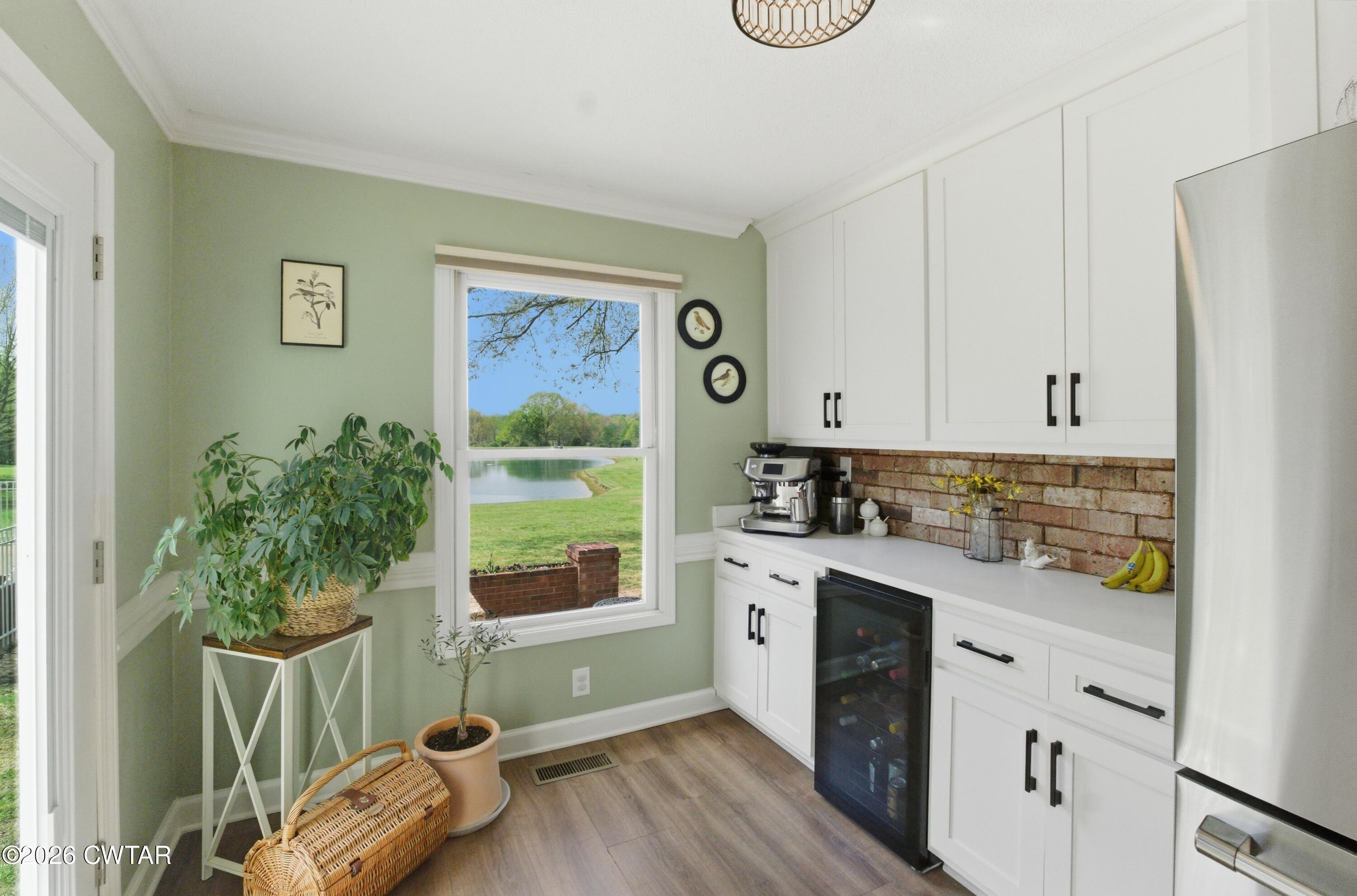 2757 Edward Williams Road Gadsden, TN 38337 - Photo 28 of 51 a kitchen with stainless steel appliances a white cabinets and a stove top oven